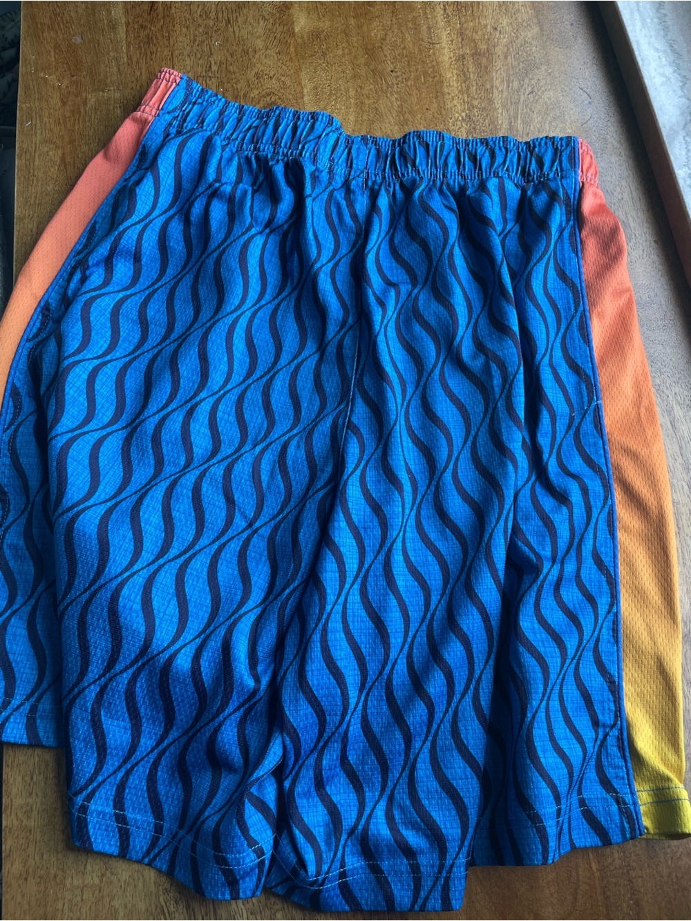 Men's Blue Wave Athletic Lacrosse Shorts with Orange Gradient Sides - Picture 6 of 6